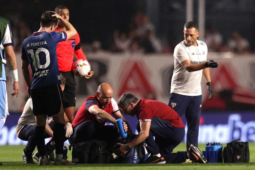 Nacional defender Izquierdo collapses on the pitch during match against Sao Paulo